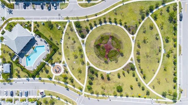 an aerial view of a house with a swimming pool