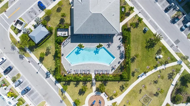 an aerial view of a house with a garden and plants