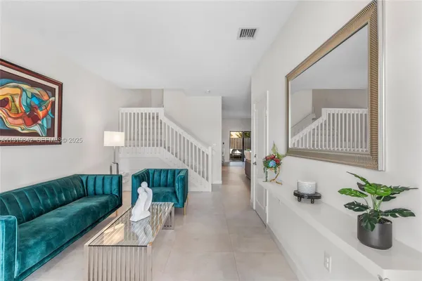 a living room with furniture and a couch