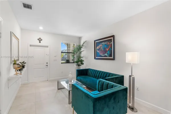 a living room with furniture and a rug