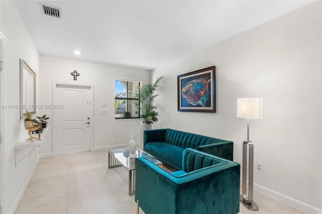 a living room with furniture and a rug