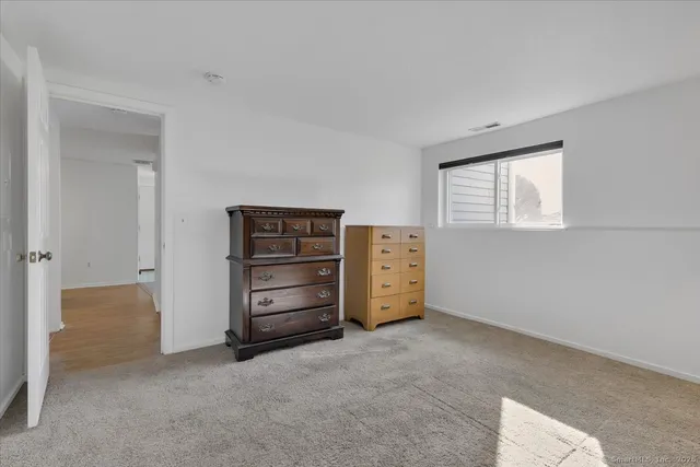 a view of room with closet and cabinet