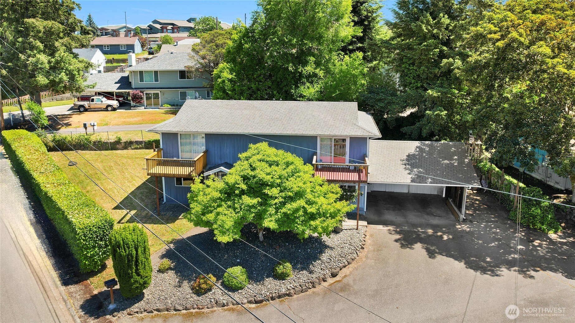 2533 Fir Avenue Bremerton, WA 98310 - Photo 33 of 38 a view of a patio with table and chairs potted plants