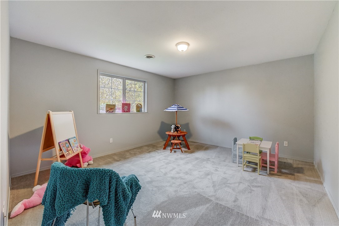 2319 Cherry Road Lake Stevens, WA 98258 - Photo 19 of 25 a living room with furniture and a gym machine