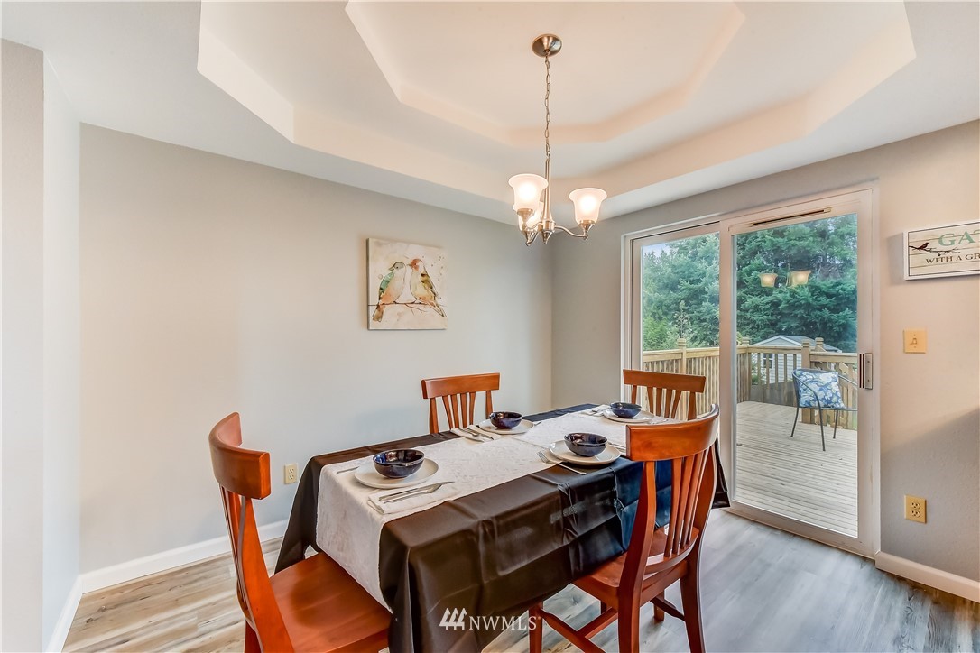 2319 Cherry Road Lake Stevens, WA 98258 - Photo 5 of 25 a view of a dining room with furniture window and wooden floor