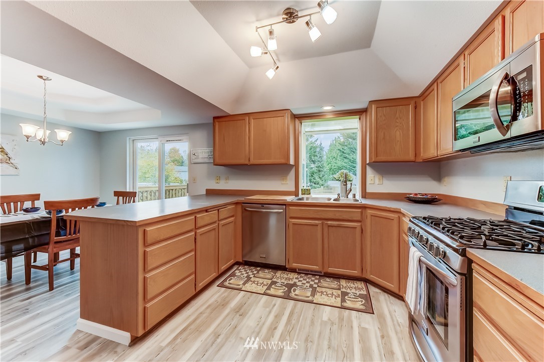 2319 Cherry Road Lake Stevens, WA 98258 - Photo 9 of 25 a kitchen with stainless steel appliances granite countertop a stove and a sink