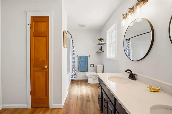 a en suite bathroom with a sink a mirror and a shower