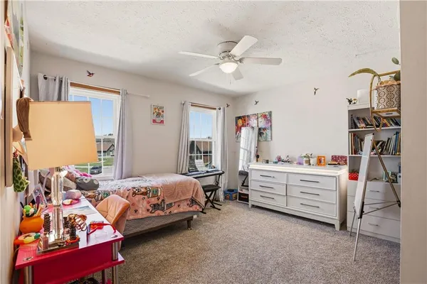 a room with a bed and a chandelier