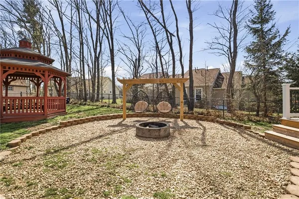 a front view of a house with garden and patio