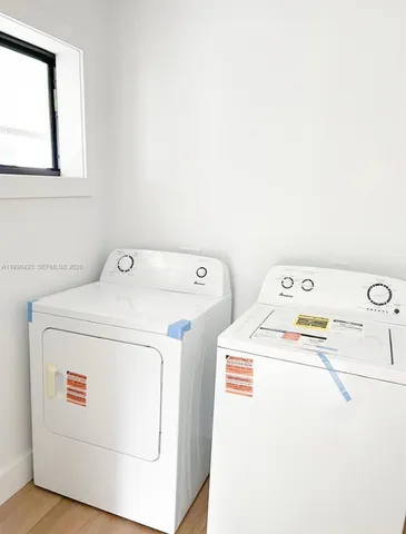 a utility room with dryer and washer