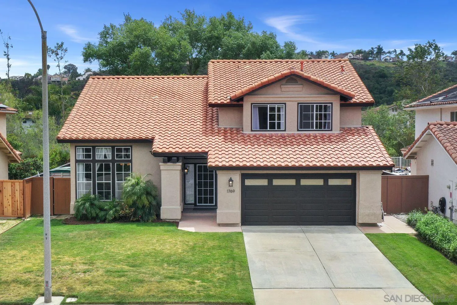 1769 Willowhaven Road Encinitas, CA 92024 - Photo 1 of 36 a front view of a house with a garden