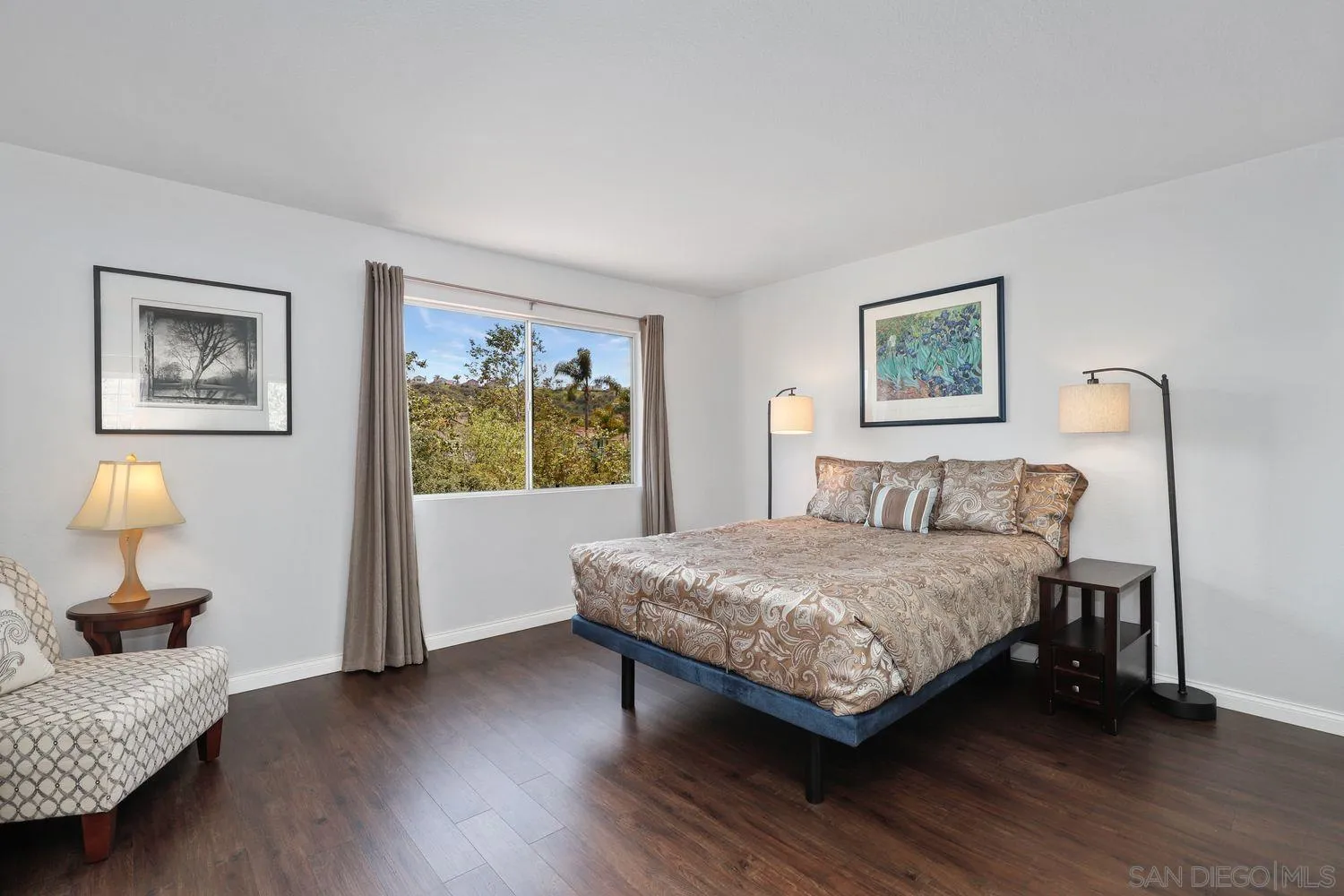 1769 Willowhaven Road Encinitas, CA 92024 - Photo 19 of 36 a bedroom with a bed wooden floor and window