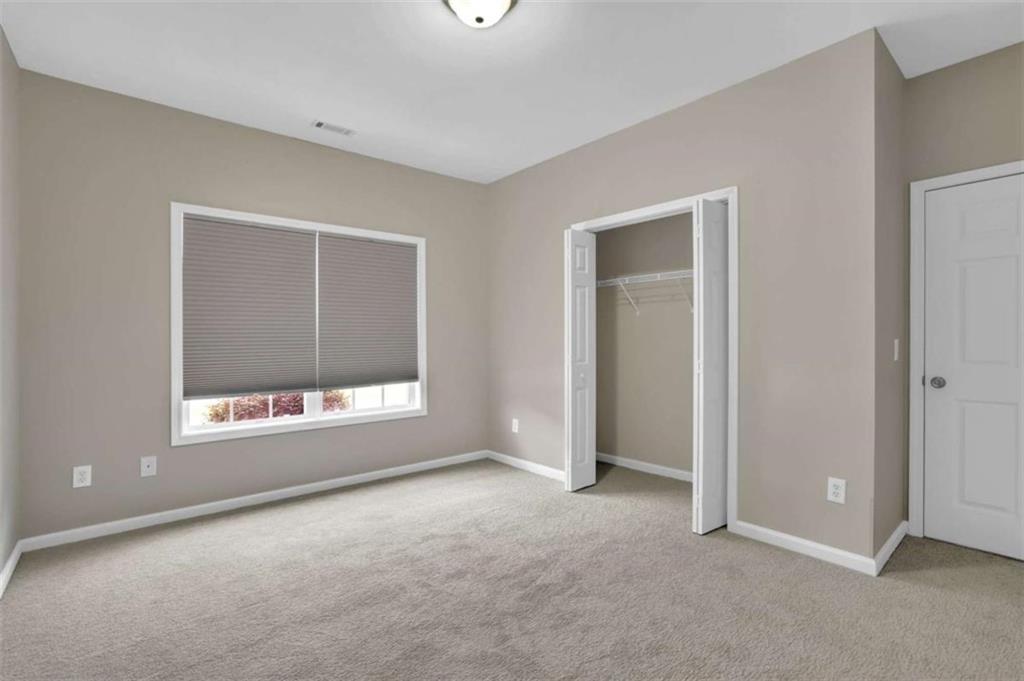 140 Stonegate Lane Canton, GA 30114 - Photo 30 of 38 a view of an empty room with a window