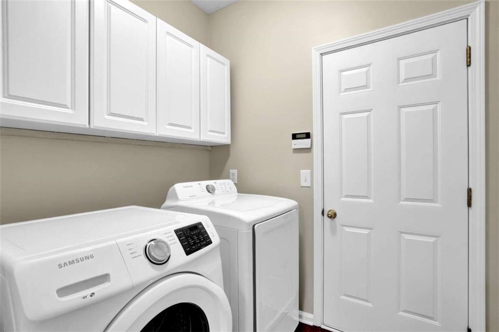 140 Stonegate Lane Canton, GA 30114 - Photo 32 of 38 a utility room with dryer and washer