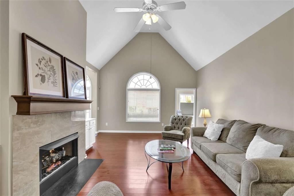 140 Stonegate Lane Canton, GA 30114 - Photo 6 of 38 a living room with furniture and a fireplace