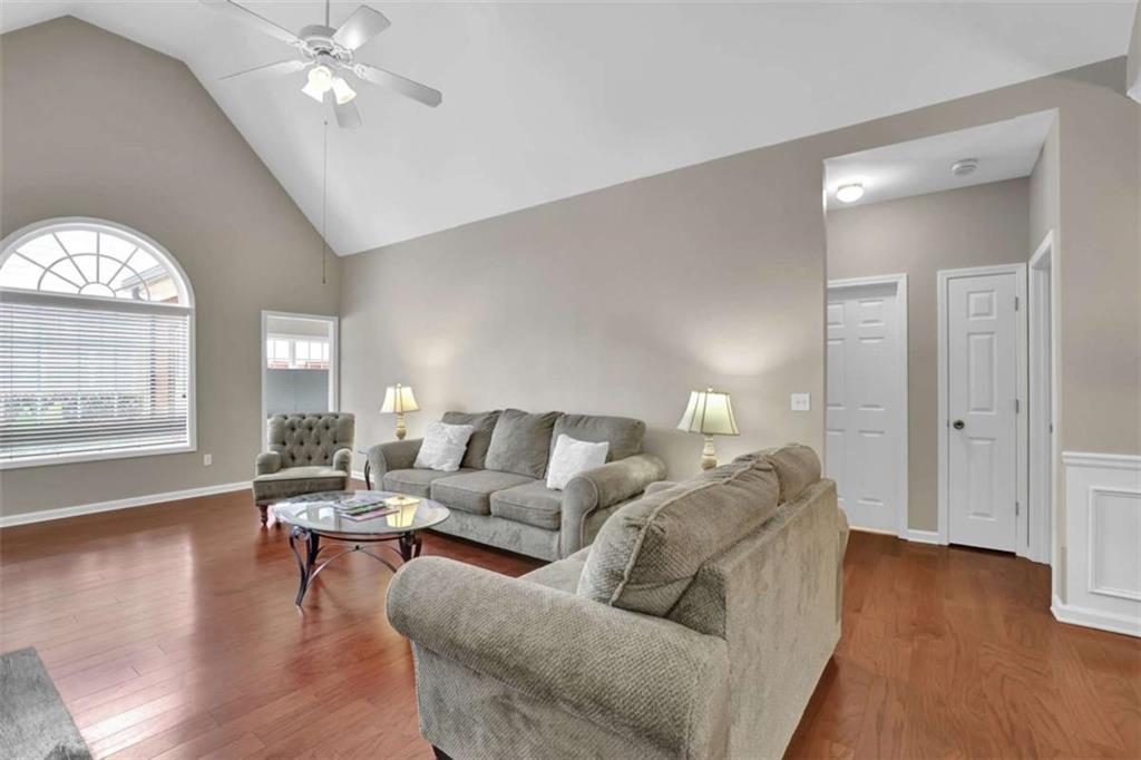 140 Stonegate Lane Canton, GA 30114 - Photo 7 of 38 a living room with furniture and a wooden floor