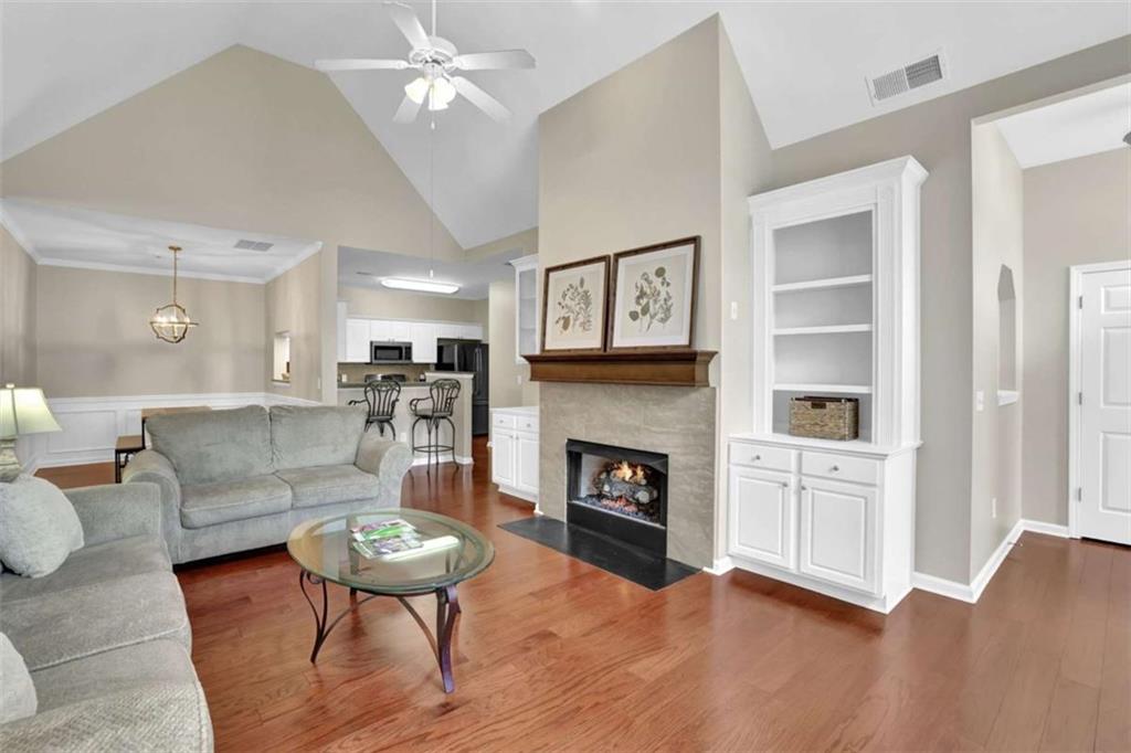 140 Stonegate Lane Canton, GA 30114 - Photo 10 of 38 a living room with furniture and a fireplace