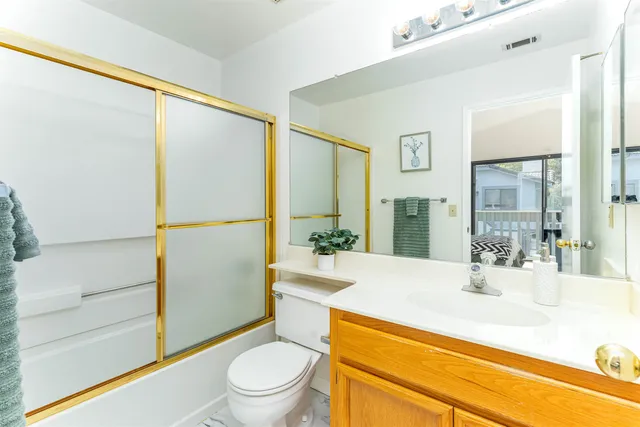 a bathroom with a sink a mirror and a toilet