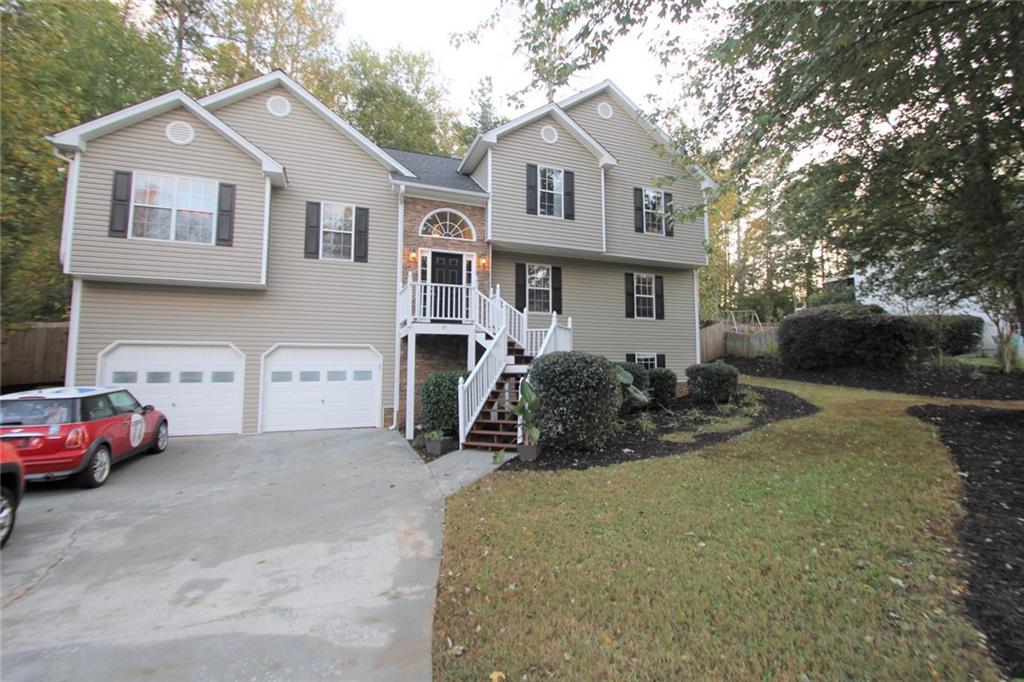 108 Sable Trace Lane Acworth, GA 30102 - Photo 1 of 1 a front view of a house with a garden and parking