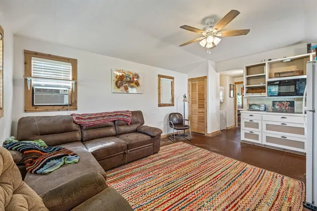 a living room with furniture and a rug