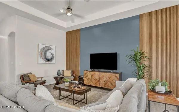 a living room with furniture and a flat screen tv