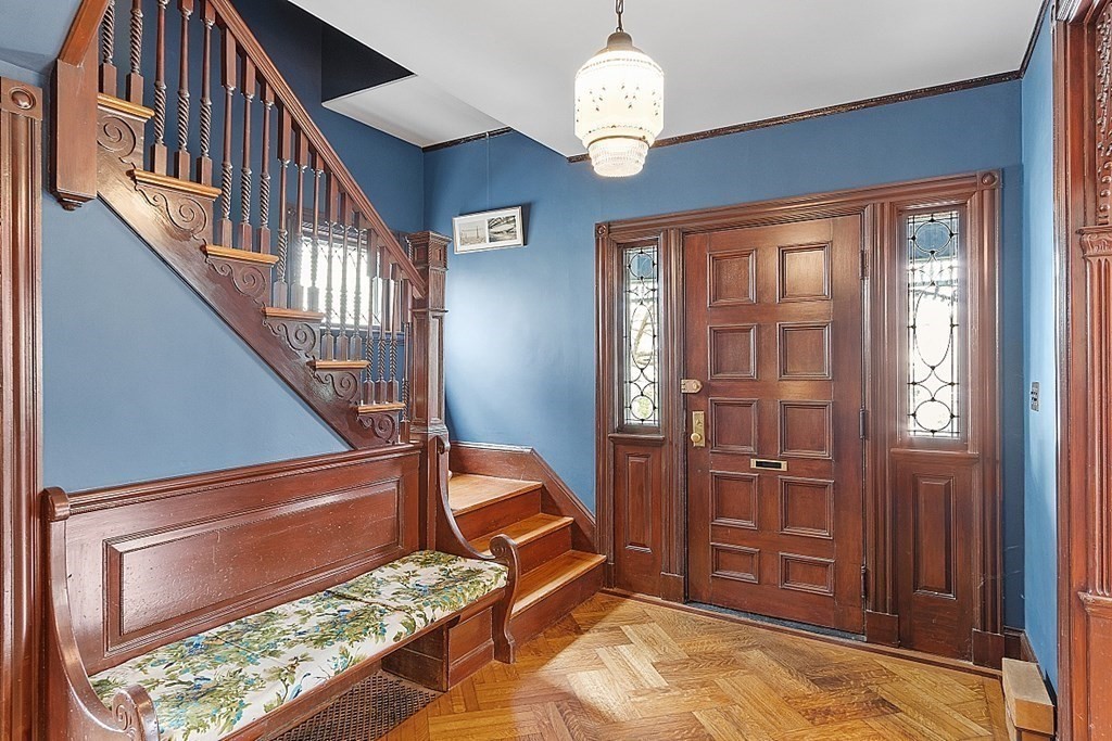 23 Wellesley Park Boston, MA 02124 - Photo 11 of 42 a view of a livingroom with wooden floor and stairs