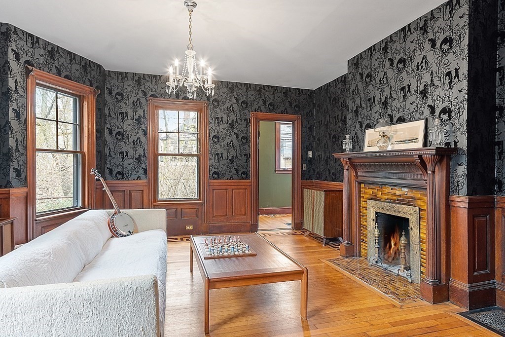 23 Wellesley Park Boston, MA 02124 - Photo 21 of 42 a living room with furniture a window and a fireplace