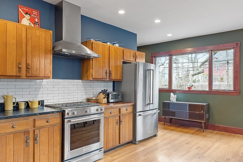 23 Wellesley Park Boston, MA 02124 - Photo 25 of 42 a kitchen with stainless steel appliances a stove refrigerator sink and cabinets