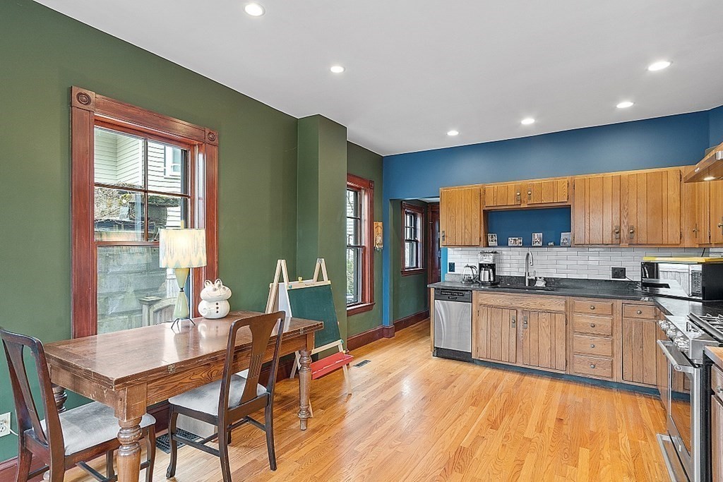 23 Wellesley Park Boston, MA 02124 - Photo 27 of 42 a large kitchen with a table and chairs in it