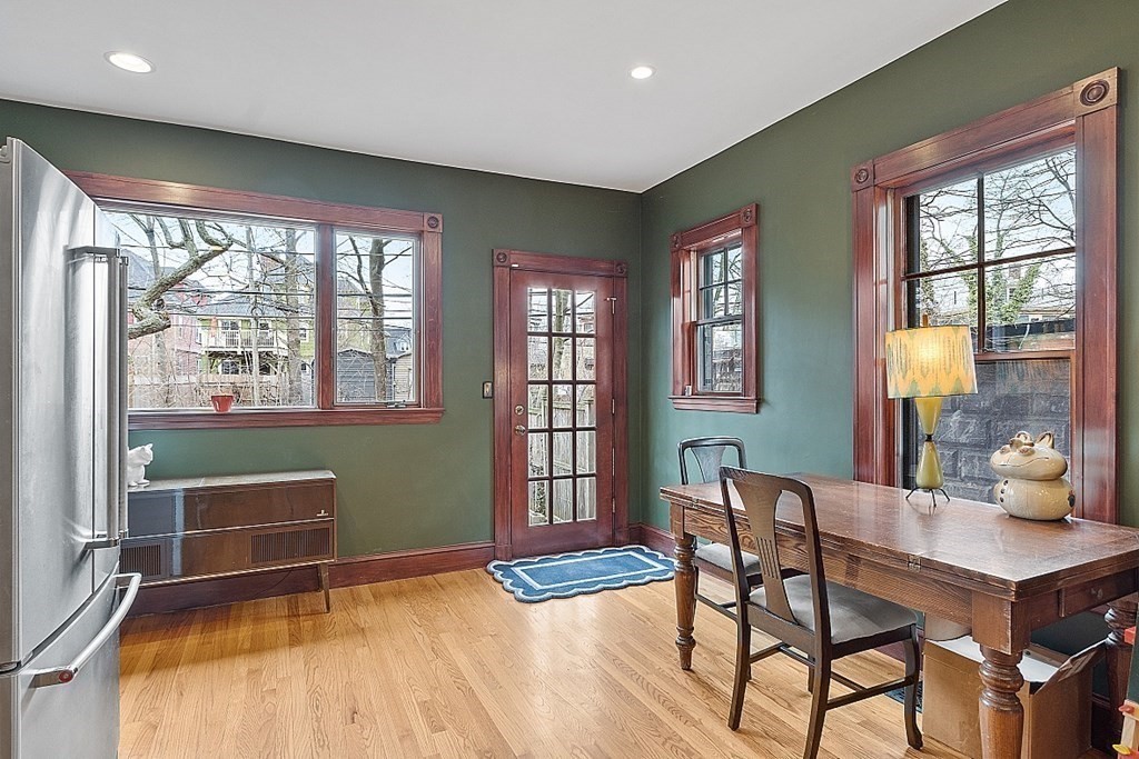 23 Wellesley Park Boston, MA 02124 - Photo 28 of 42 a room with a wooden table and chairs