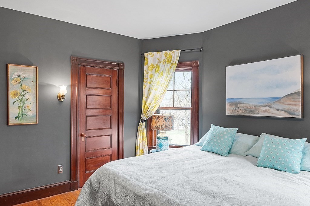 23 Wellesley Park Boston, MA 02124 - Photo 31 of 42 a bedroom with a bed and a window