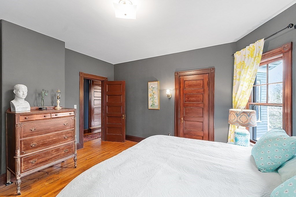 23 Wellesley Park Boston, MA 02124 - Photo 32 of 42 a bedroom with a bed and a dresser