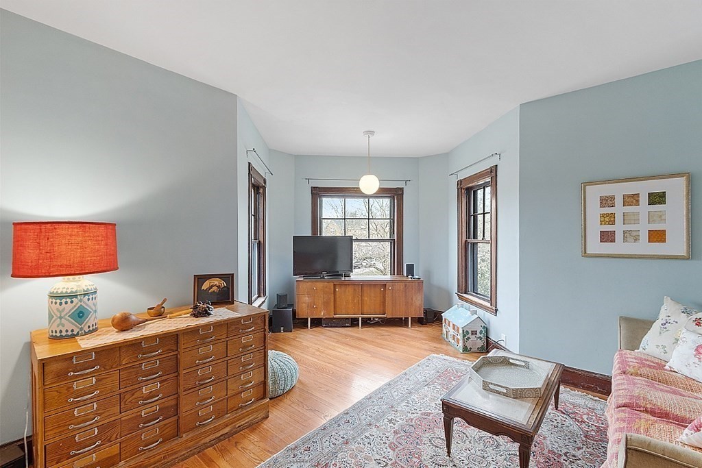 23 Wellesley Park Boston, MA 02124 - Photo 33 of 42 a living room with furniture and a flat screen tv