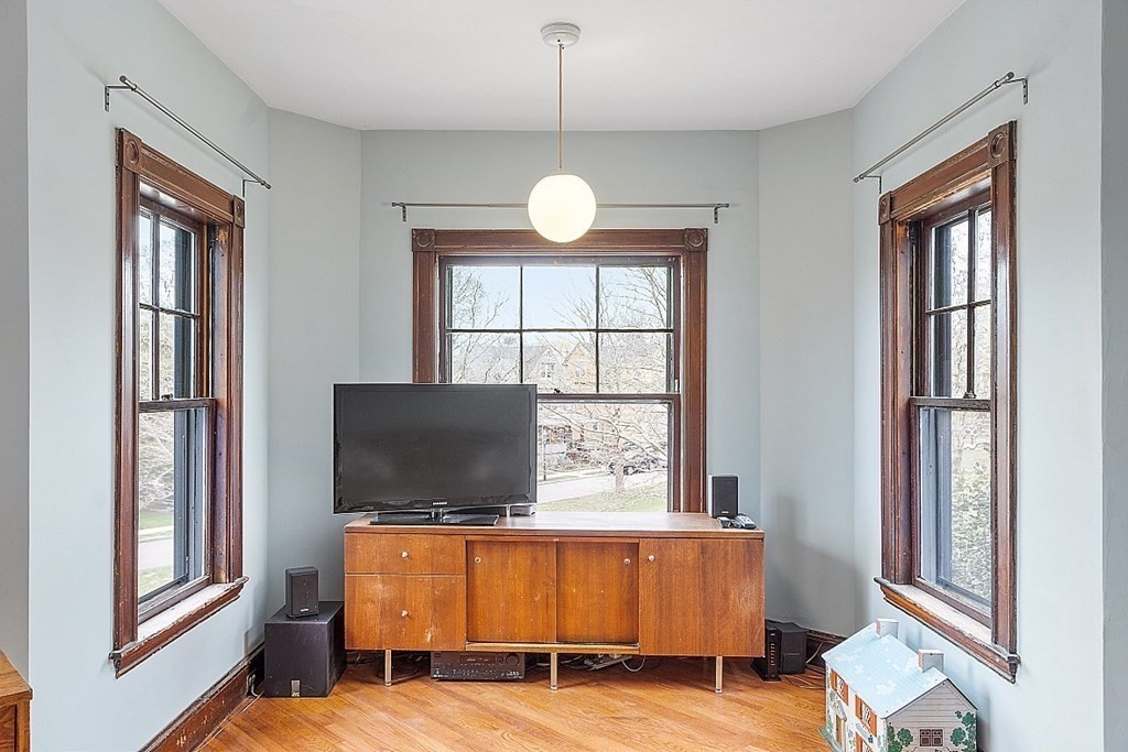 23 Wellesley Park Boston, MA 02124 - Photo 34 of 42 a living room with furniture window and flat screen tv