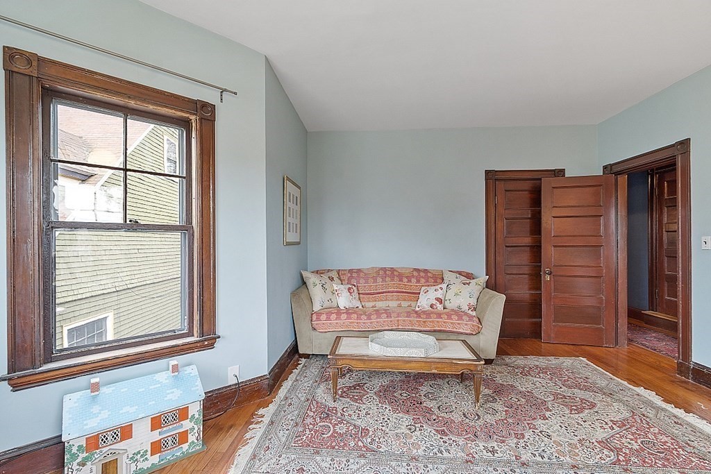 23 Wellesley Park Boston, MA 02124 - Photo 35 of 42 a living room with furniture a window and a rug