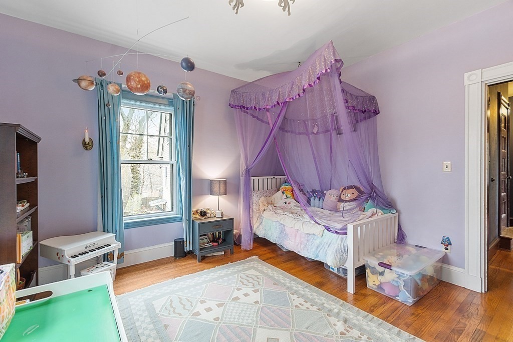 23 Wellesley Park Boston, MA 02124 - Photo 36 of 42 a bedroom with a bed and a window