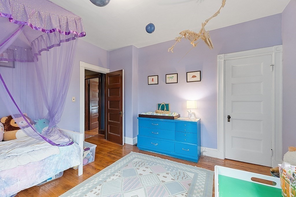 23 Wellesley Park Boston, MA 02124 - Photo 37 of 42 a bedroom with a bed and a dresser