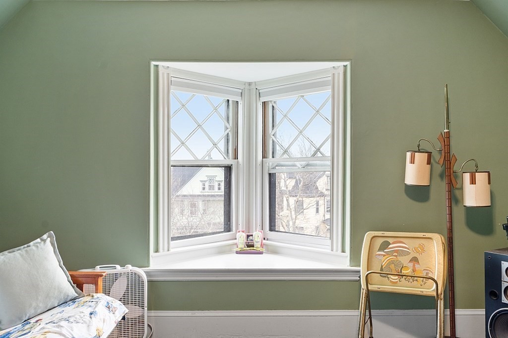 23 Wellesley Park Boston, MA 02124 - Photo 39 of 42 a bath tub sitting in a bedroom next to a window