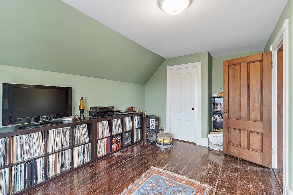23 Wellesley Park Boston, MA 02124 - Photo 41 of 42 a living room with furniture and a flat screen tv