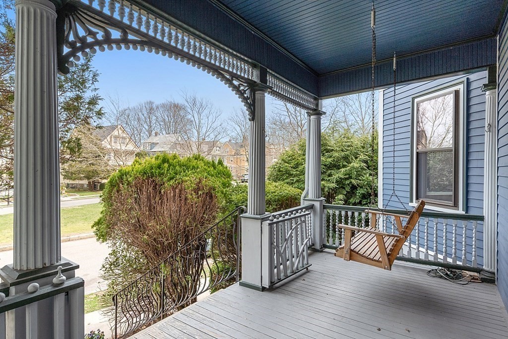 23 Wellesley Park Boston, MA 02124 - Photo 6 of 42 a view of a porch with wooden floor and floor to ceiling window
