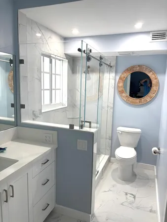a bathroom with a sink a toilet and a shower