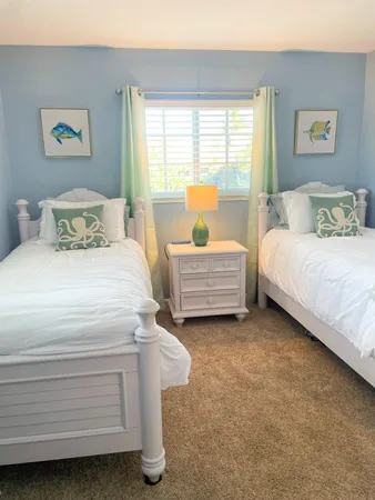 a spacious bedroom with a bed and a couch
