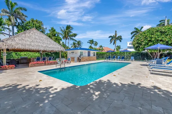 a view of a swimming pool with a patio