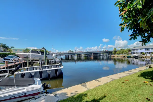 a view of a lake with boats and trees