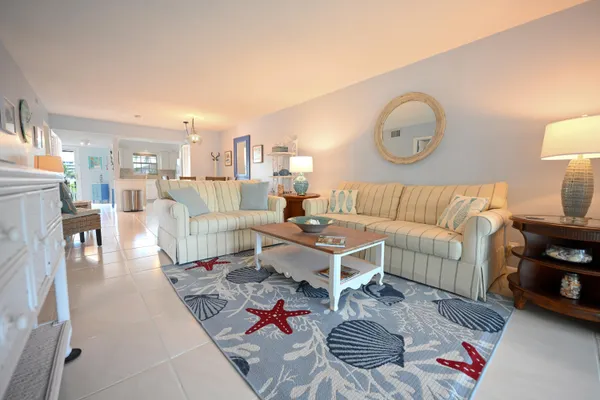a living room with furniture and a table