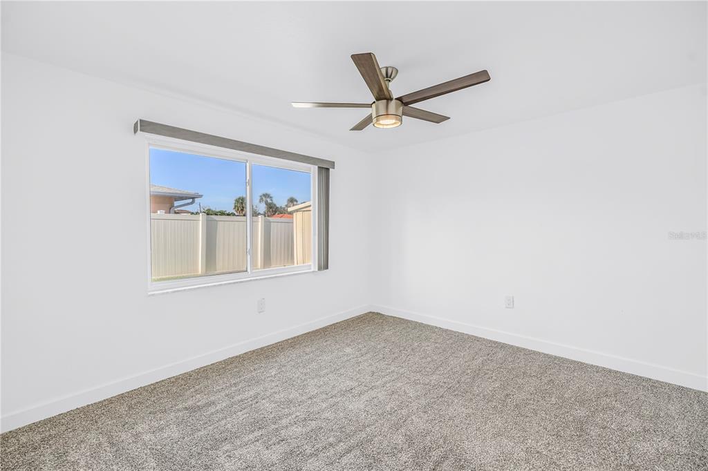 8630 Blind Pass Road, Unit 12 St. Pete Beach, FL 33706 - Photo 20 of 30 an empty room with a window