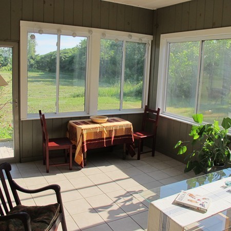 1 Juggler Meadow Road Leverett, MA 01054 - Photo 16 of 23 a bedroom with a bed and a table