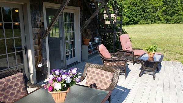 1 Juggler Meadow Road Leverett, MA 01054 - Photo 18 of 23 a front view of a house with outdoor seating