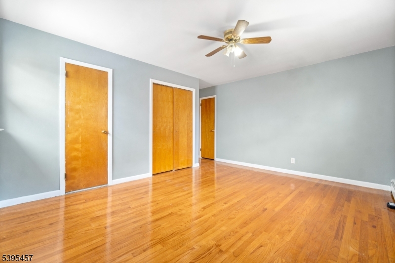 726 Gates Terrace Union, NJ 07083 - Photo 13 of 16 wooden floor in an empty room with a window