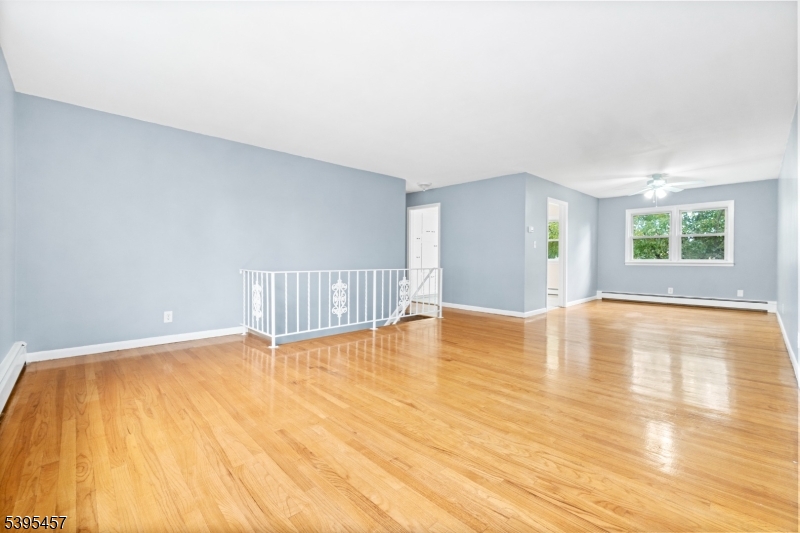 726 Gates Terrace Union, NJ 07083 - Photo 3 of 16 a view of empty room with wooden floor and fan